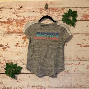 A grey justice shirt.